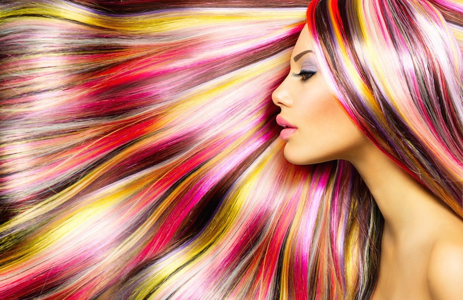 alt="Model posing in profile with beautiful, multicolored and shiny hair style"